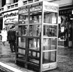 Photo of phone booths with 911 instructions.